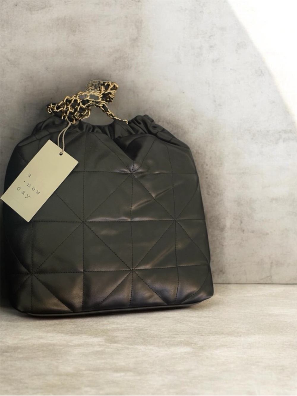 a new day Black Quilted Drawstring Shoulder Bag with Gold Chain